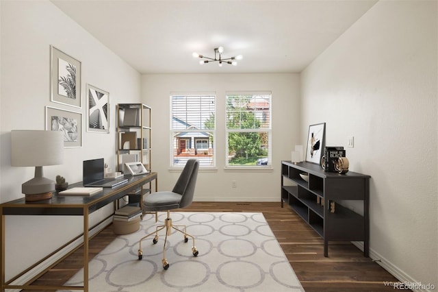 office space with dark hardwood / wood-style flooring and a notable chandelier