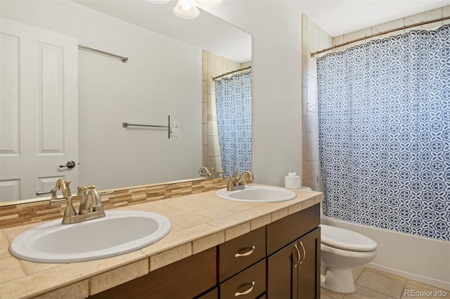 full bathroom featuring shower / bathtub combination with curtain, tile patterned flooring, vanity, and toilet