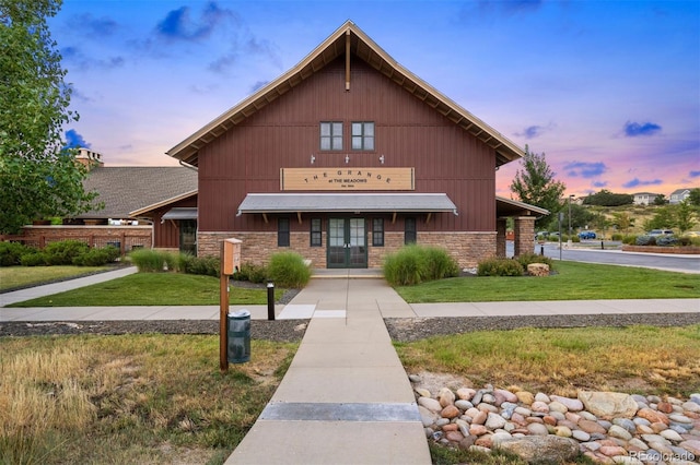 view of outdoor building at dusk