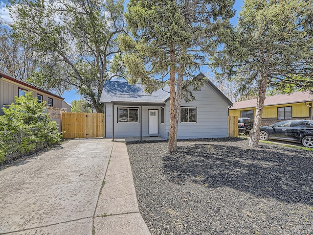 view of front of property featuring fence and a gate