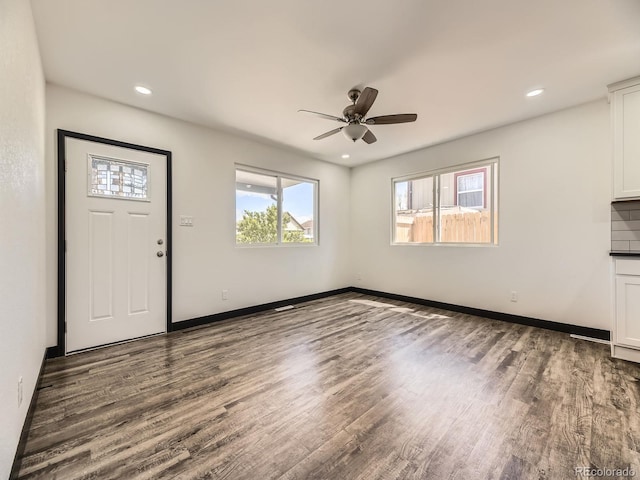 foyer featuring healthy amount of natural light, wood finished floors, a ceiling fan, and recessed lighting