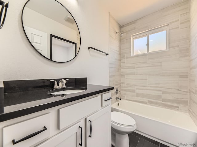 bathroom featuring toilet, vanity, shower / washtub combination, and tile patterned floors