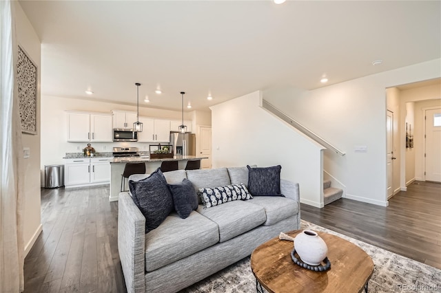 living room featuring dark hardwood / wood-style flooring