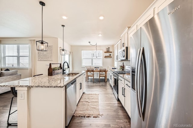 kitchen with white cabinetry, appliances with stainless steel finishes, and sink