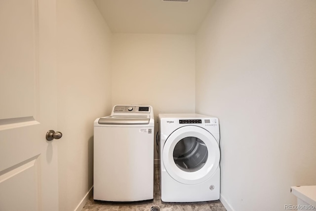 laundry room featuring washer and clothes dryer