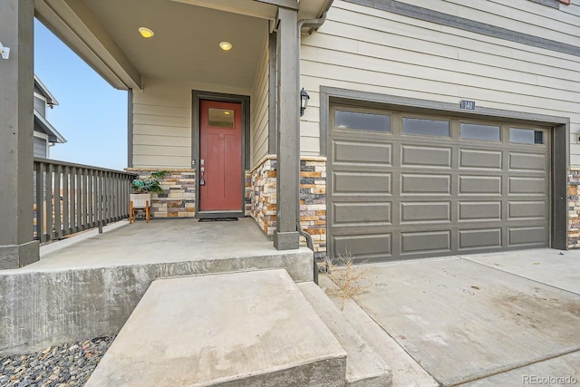 view of exterior entry featuring a garage