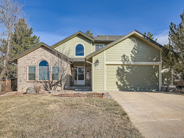 front facade featuring a front lawn and a garage