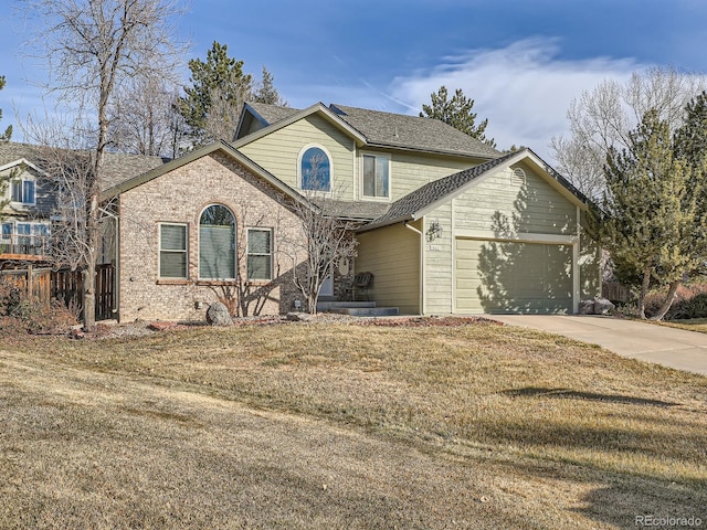 front of property with a front yard and a garage