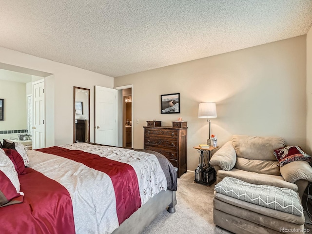 bedroom featuring light carpet and a textured ceiling