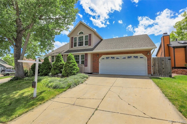 13270 W 65th Ave, Arvada, CO 80004 - traditional-style house featuring driveway, an attached garage, a shingled roof, and brick siding
