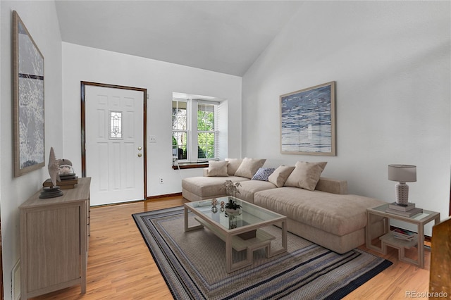 13270 W 65th Ave, Arvada, CO 80004 - living area with light wood-type flooring and lofted ceiling