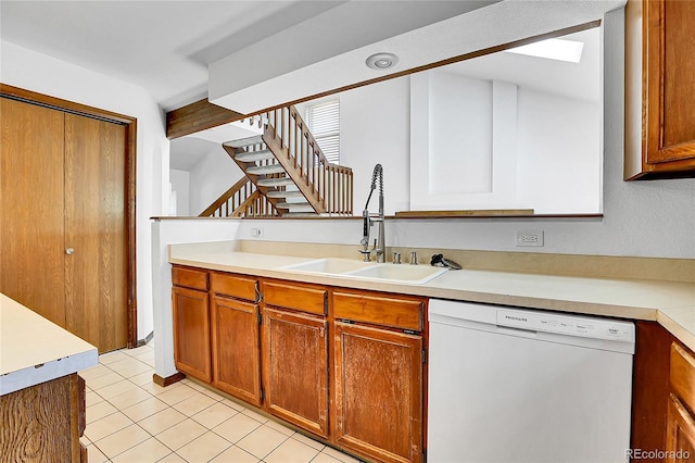 13270 W 65th Ave, Arvada, CO 80004 - kitchen with dishwasher, a sink, light countertops, brown cabinets, and light tile patterned flooring