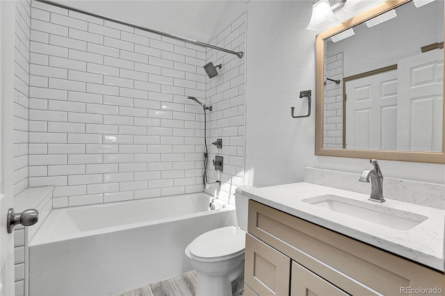13270 W 65th Ave, Arvada, CO 80004 - full bath featuring toilet, shower / tub combination, vanity, wood finished floors, and a textured wall