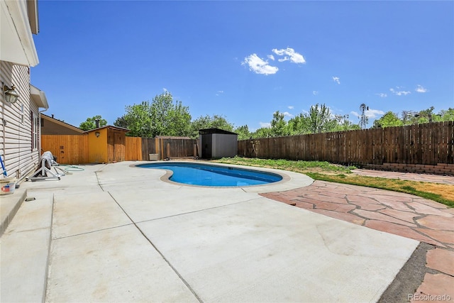 13270 W 65th Ave, Arvada, CO 80004 - view of pool featuring a shed, a patio area, a fenced backyard, and an outdoor structure