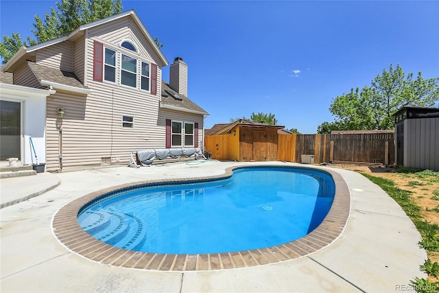 13270 W 65th Ave, Arvada, CO 80004 - view of swimming pool with a fenced backyard and a patio