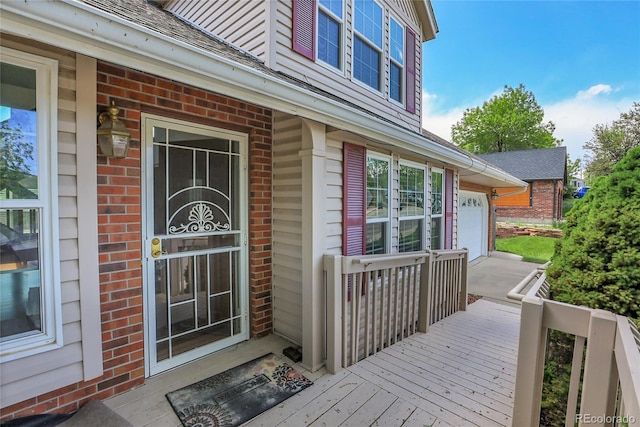 13270 W 65th Ave, Arvada, CO 80004 - property entrance featuring brick siding and a garage