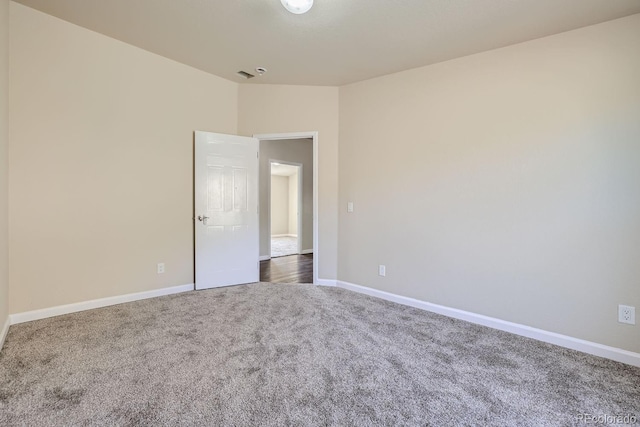 unfurnished room featuring carpet flooring