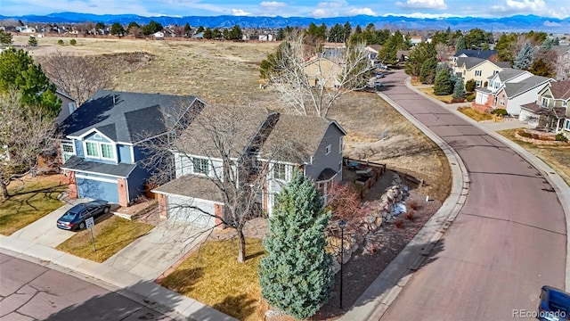 bird's eye view featuring a mountain view and a residential view