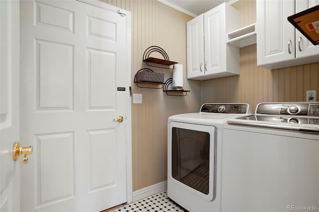 washroom featuring cabinet space and separate washer and dryer