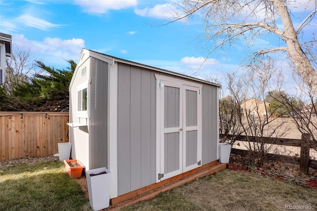 view of shed with fence