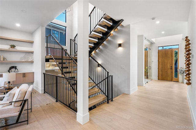 stairs with hardwood / wood-style flooring