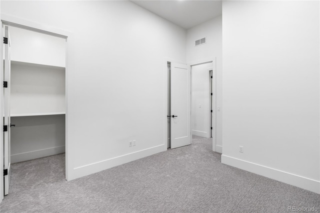 unfurnished bedroom with light carpet