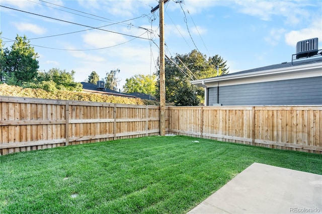 view of yard featuring a patio and central air condition unit