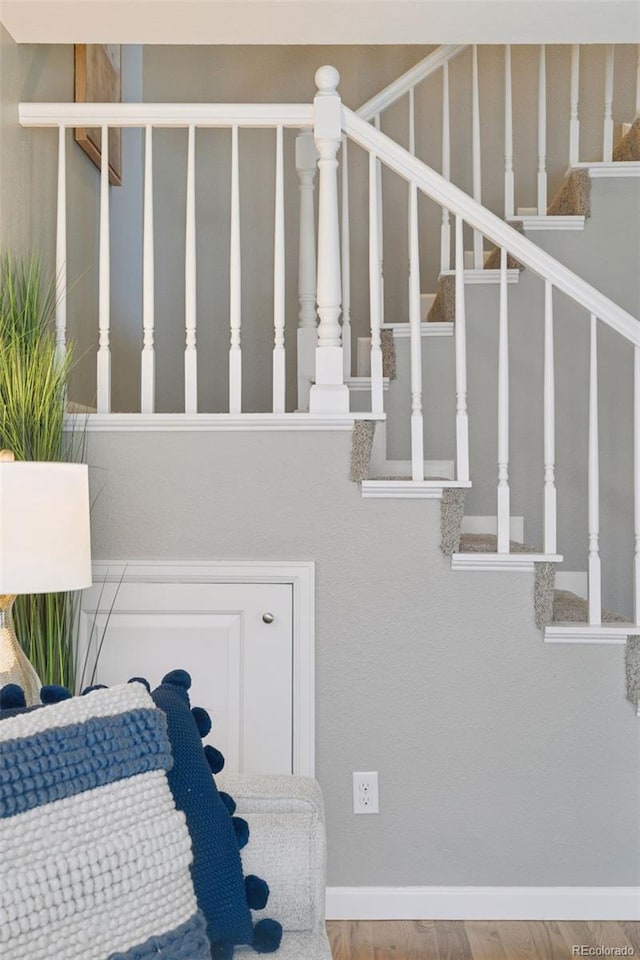 2854 N Lowell Blvd, Denver, CO 80211 - staircase with baseboards and wood finished floors