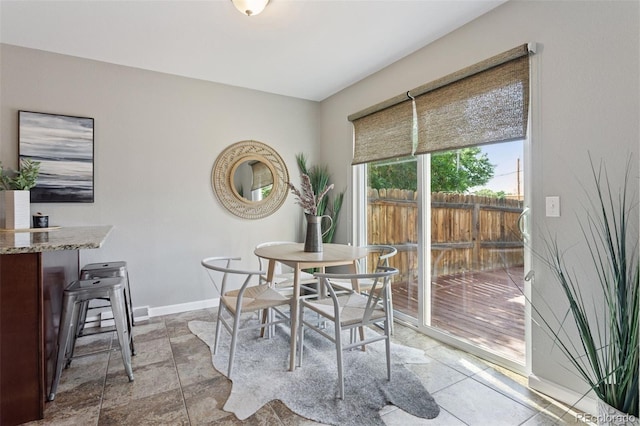 2854 N Lowell Blvd, Denver, CO 80211 - dining space with baseboards and stone finish floors