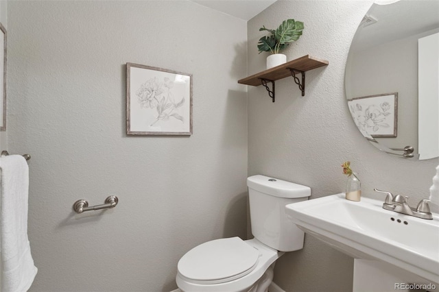 2854 N Lowell Blvd, Denver, CO 80211 - bathroom with toilet and a sink