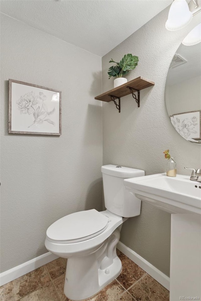 2854 N Lowell Blvd, Denver, CO 80211 - bathroom featuring toilet and tile patterned flooring