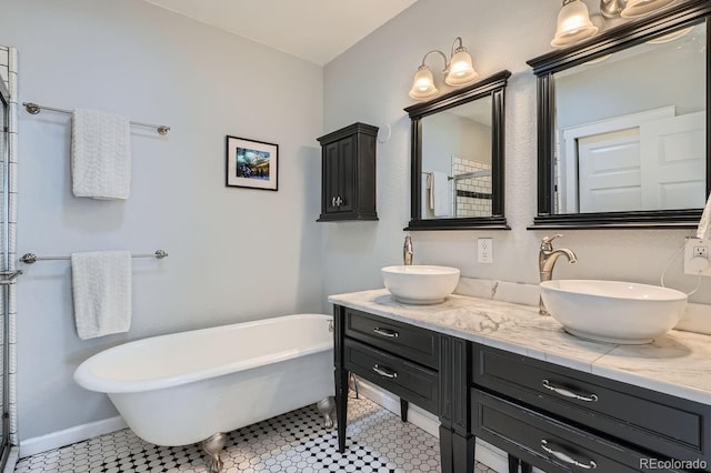 full bathroom featuring tile patterned flooring, a soaking tub, a sink, and double vanity