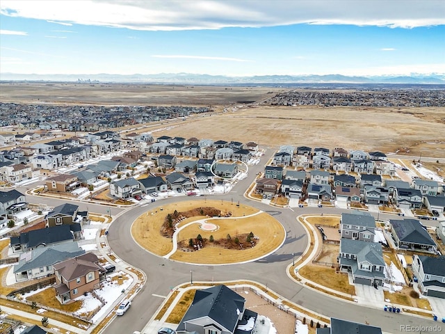 birds eye view of property with a mountain view and a residential view