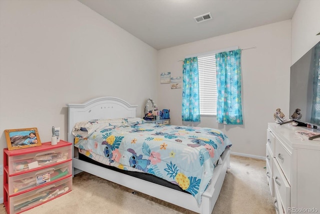 bedroom featuring baseboards, visible vents, and light colored carpet