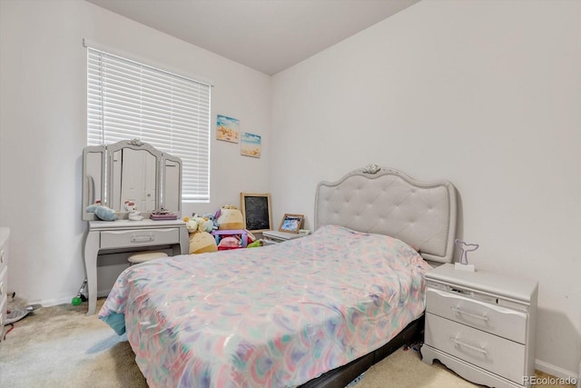 bedroom with carpet flooring and baseboards