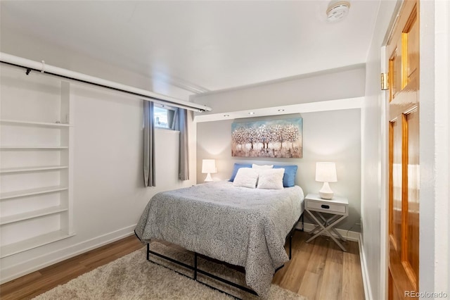 1120 N Clarkson St Unit 6, Denver, CO 80218 - bedroom featuring wood finished floors and baseboards