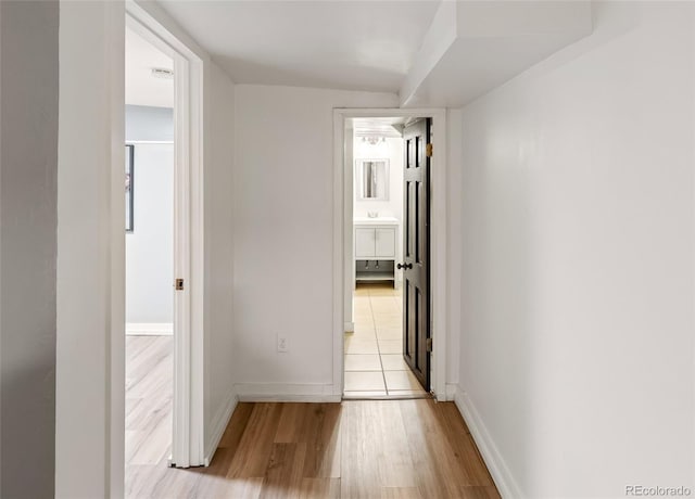 1120 N Clarkson St Unit 6, Denver, CO 80218 - hallway with light wood-style flooring and baseboards
