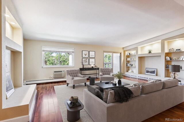 living room featuring a baseboard heating unit, dark wood-type flooring, a fireplace, a wall mounted AC, and built in features