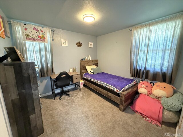 14 W 3rd St, Flagler, CO 80815 - bedroom featuring carpet floors and multiple windows