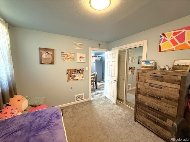 14 W 3rd St, Flagler, CO 80815 - bedroom featuring baseboards, a closet, and carpet flooring