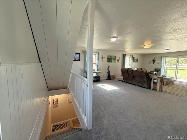 14 W 3rd St, Flagler, CO 80815 - carpeted living area featuring a textured ceiling