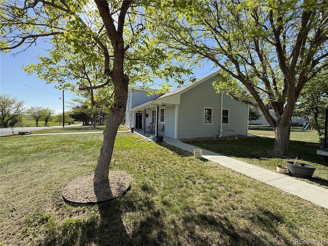 14 W 3rd St, Flagler, CO 80815 - view of front facade with a front lawn and a porch