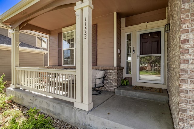 doorway to property with a porch