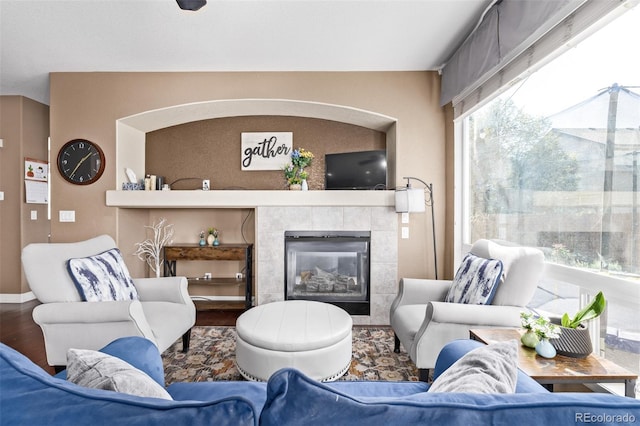 living room with hardwood / wood-style flooring and a fireplace