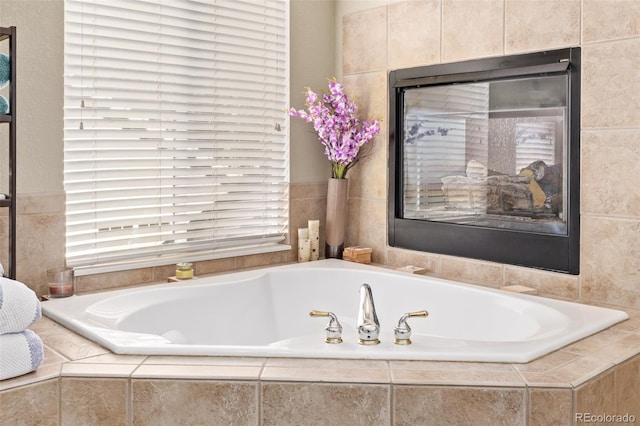 bathroom with tiled tub