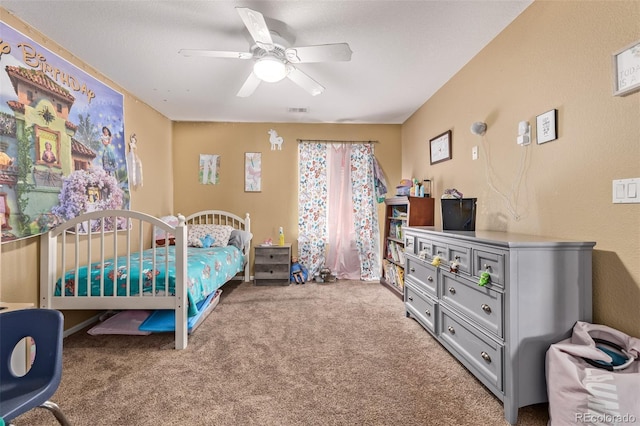 carpeted bedroom featuring visible vents and ceiling fan