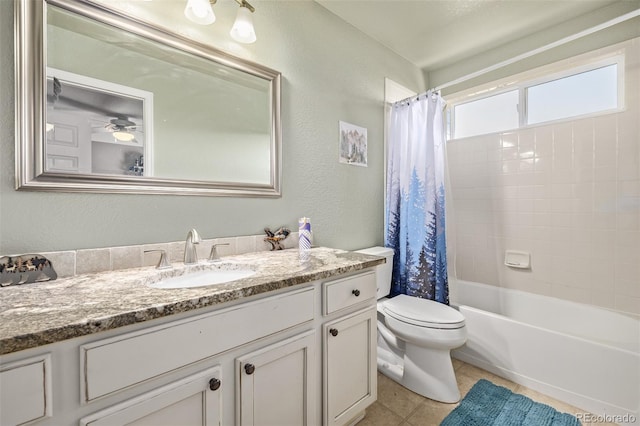 full bathroom featuring shower / bathtub combination with curtain, vanity, ceiling fan, toilet, and tile patterned floors