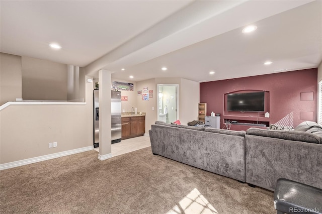 living area with light colored carpet, baseboards, indoor bar, and recessed lighting