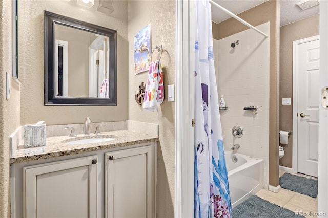 full bathroom featuring tile patterned flooring, a textured ceiling, shower / bathtub combination with curtain, vanity, and toilet