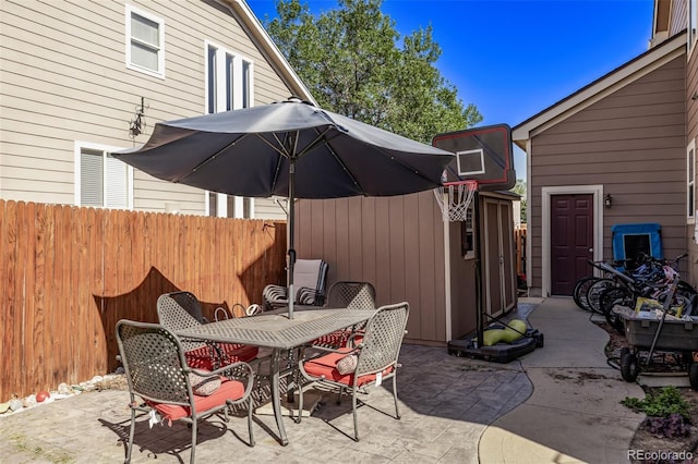 view of patio / terrace featuring outdoor dining area and fence